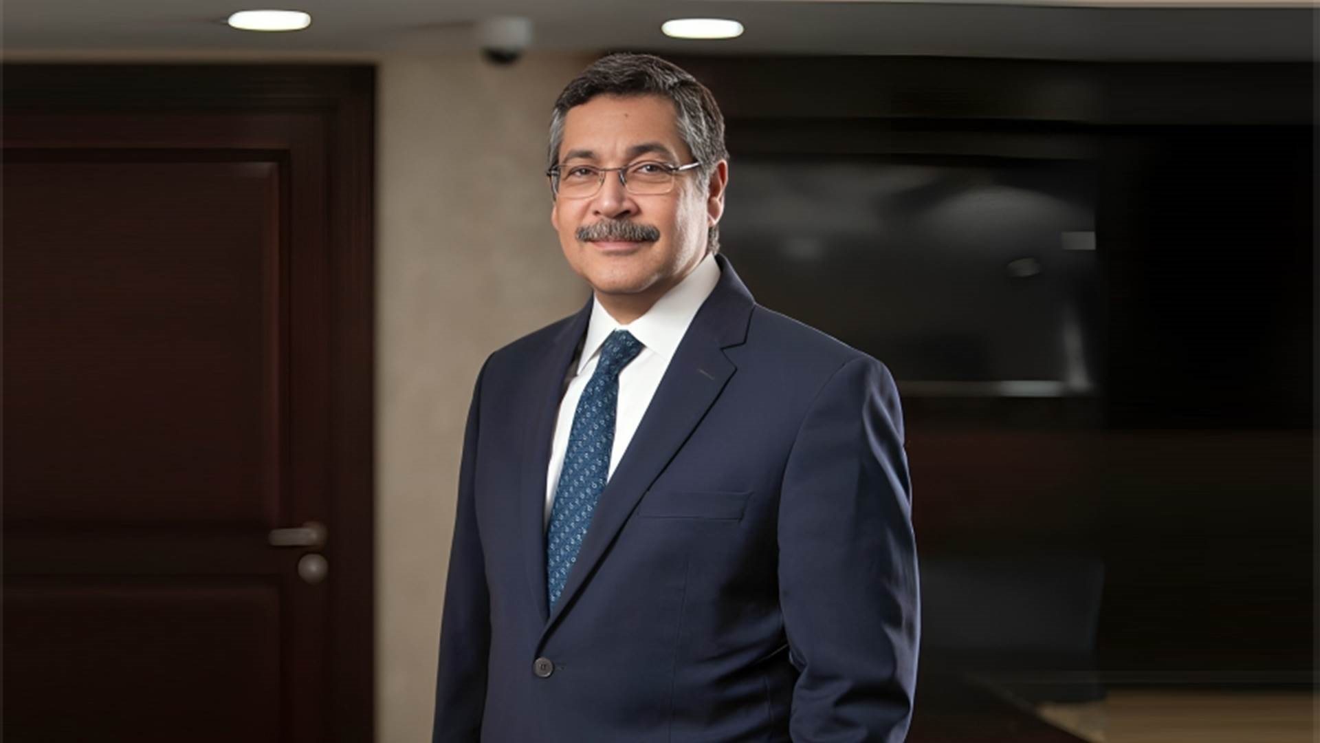 حسن غانم الرئيس التنفيذي والعضو المنتدب لبنك التعمير والإسكان  FirstBank