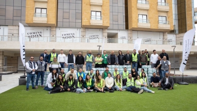 موظفو شركة «HDP» يشاركون في تعبئة كراتين الخير الغذائية